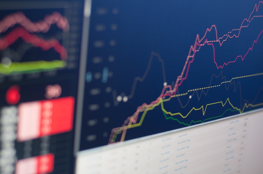 Close-up of a computer screen displaying colorful line graphs and data tables, reminiscent of financial case studies that illuminate market trends.