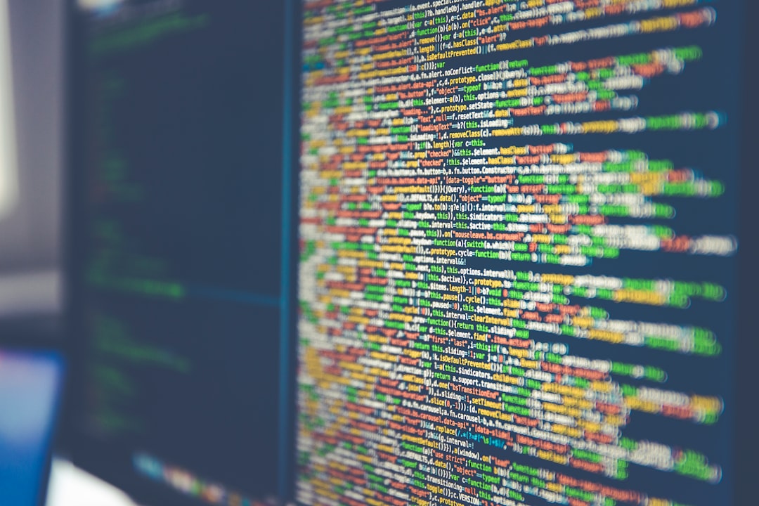 Close-up of a computer screen displaying colorful lines of code on a black background, highlighting the intricate world of AI security.